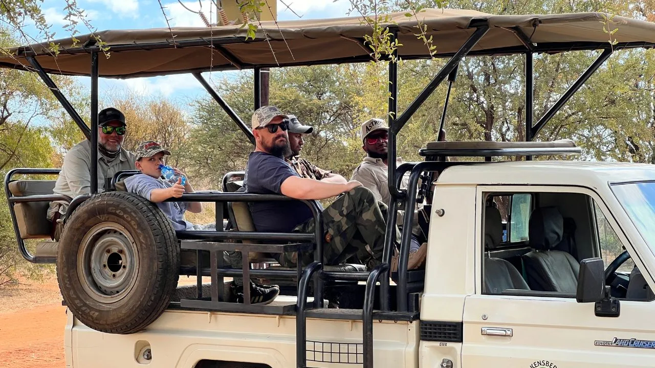 Crew under the shade of the vehicle