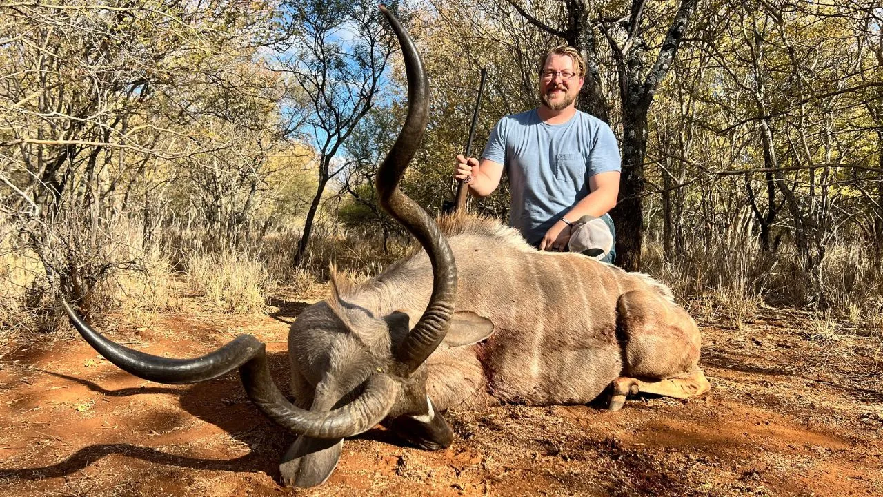 Hunter with a wildebeest bull taken on mixed bushveld